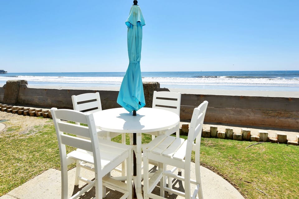Enjoy watching the waves or playing on the grass on your back patio
