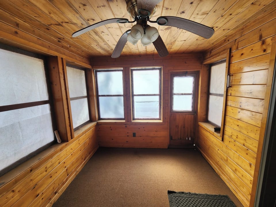 Screened in proch that leads outside.