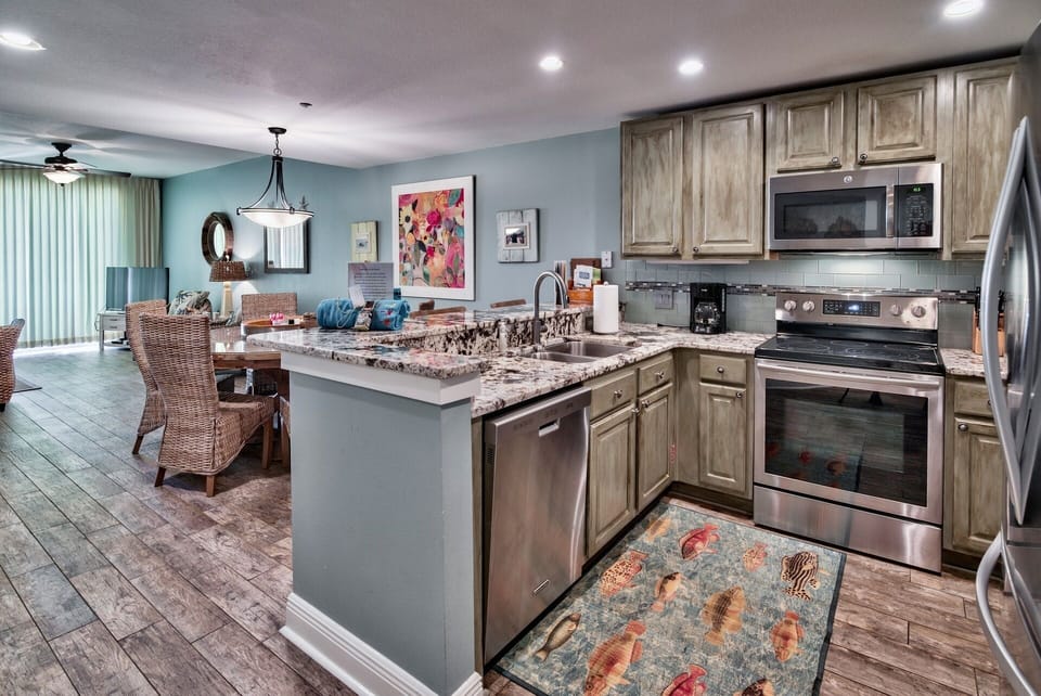 UPGRADED kitchen in late 2016 - Beautiful new granite, tile back splash, NEW stainless refrigerator. Well stocked with everything you need for a family beach vacation - regular coffee maker, crock pot, pots, pans, storage containers - and plenty of glasses and silverware.