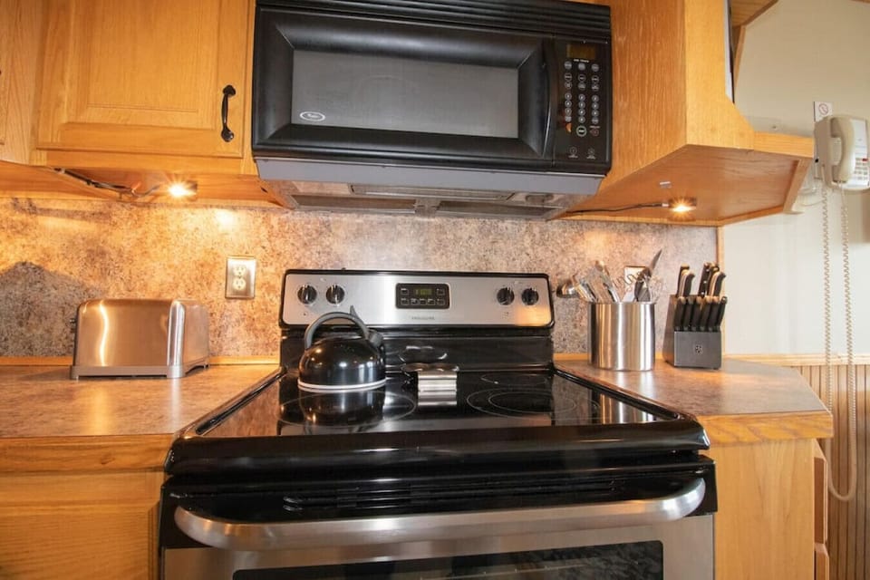 Remodeled kitchen is fully-equipped with pots, pans & utensils