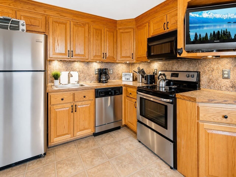 Remodeled kitchen is fully-equipped with pots, pans & utensils