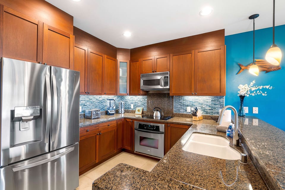 Fully Equipped Kitchen with oven range, microwave, and fridge.