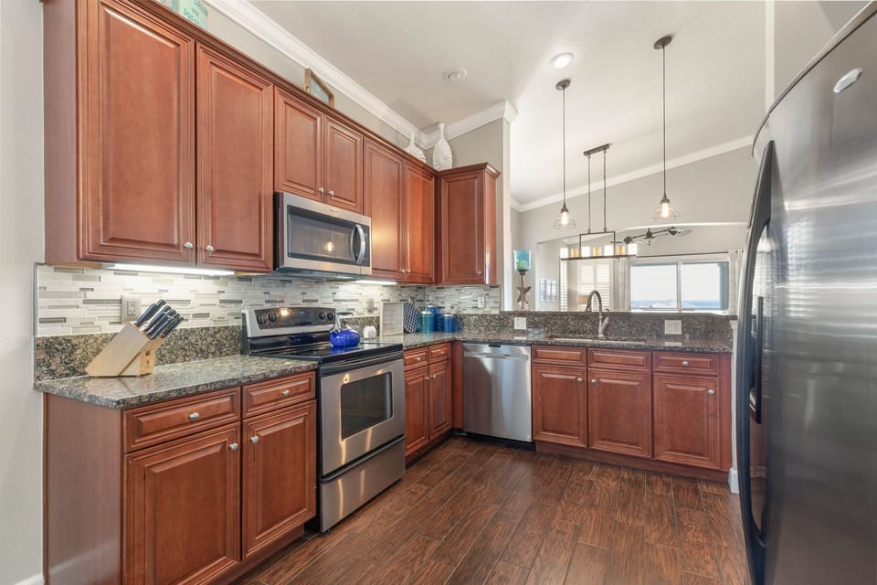 Kitchen is stocked with the cooking utensils, pots and pans that you need.