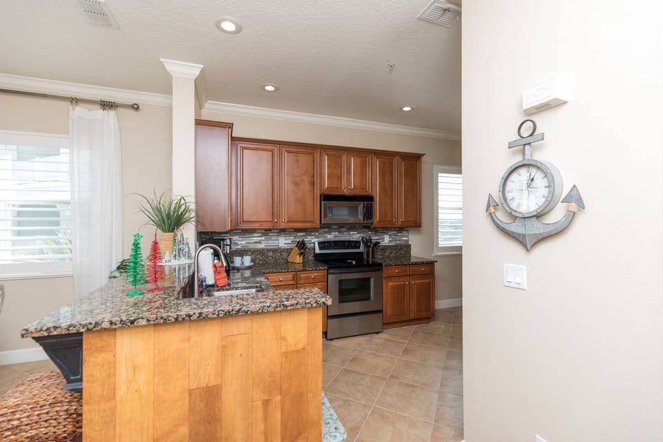 Spacious kitchen with granite countertops.