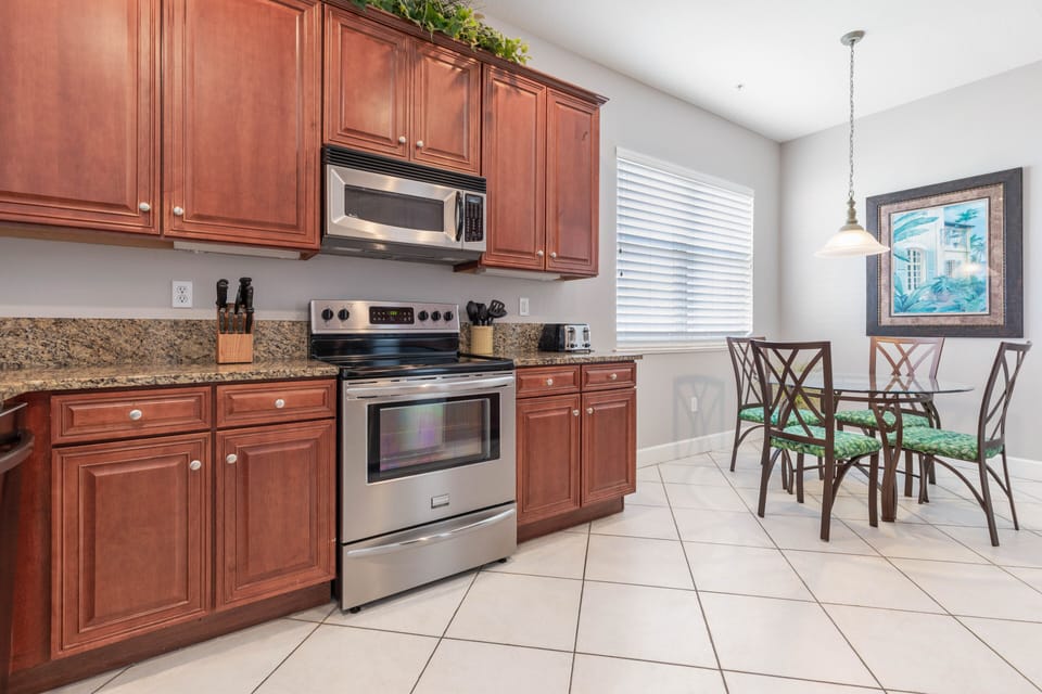 The kitchen is spacious with a cabinet and pantry space.