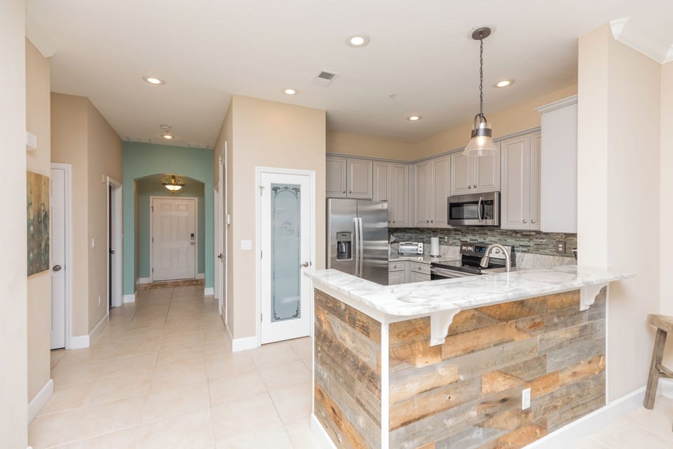 View of kitchen/entry way  from the living room