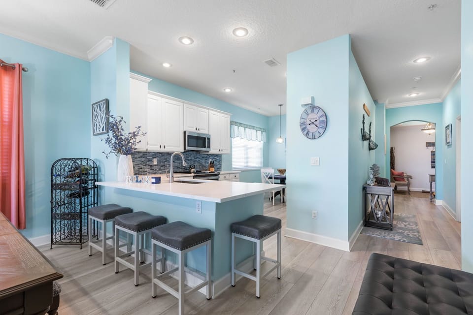 Head into the beachy keen open concept condo.