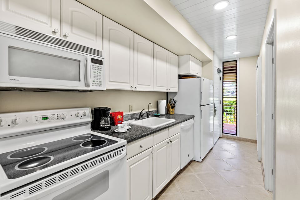 Kitchen - Enjoy the convenience of a full kitchen during your stay.