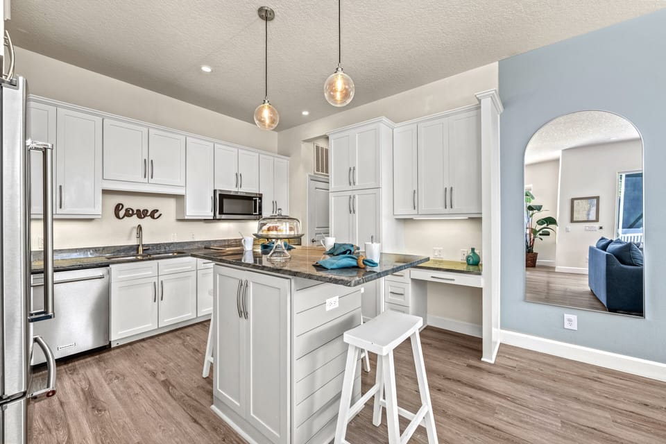 Start the day here—coffee at the island, casual bites on bar stools, or chatting with the chef while dinner simmers.