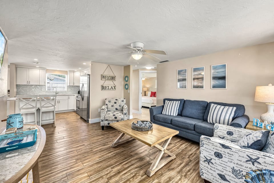 Step inside through a warm, inviting entrance where coastal charm meets modern comfort—your sanctuary starts here.