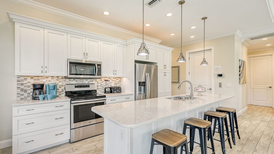 Stainless steel, sunlight, and space to cook together—this kitchen makes every meal a moment.