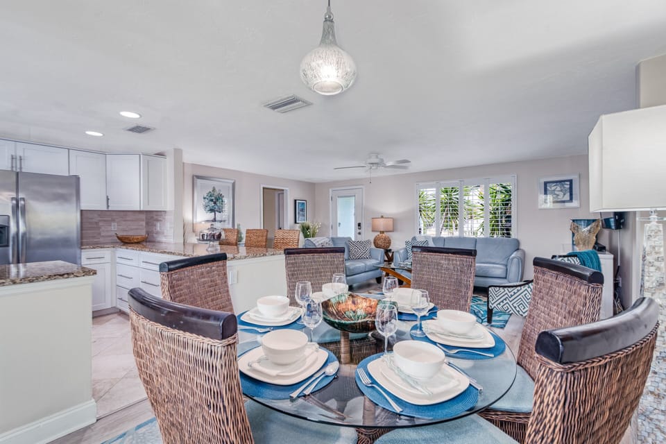A centerpiece chandelier casts a soft glow over dinnertime conversations.