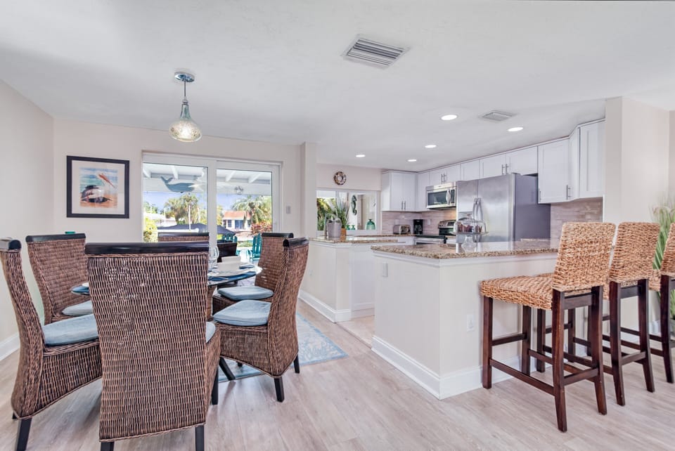 The breakfast bar invites casual conversation while the chef of the group whips up a delicious meal.