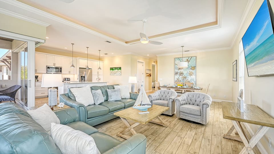 Seamless flow from kitchen to dining to living invites you to savor every meal and every relaxing moment under one sunlit roof.
