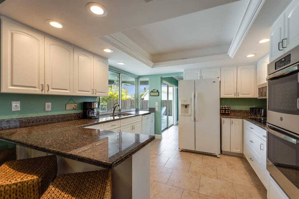 Feel the rhythm of family meals and laughter in a sleek kitchen that's ready to fuel your island escape.