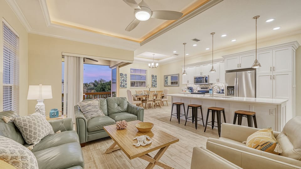 Gather around the expansive kitchen island, where chatter flows as easily as the coffee brews, setting the stage for memories made together.