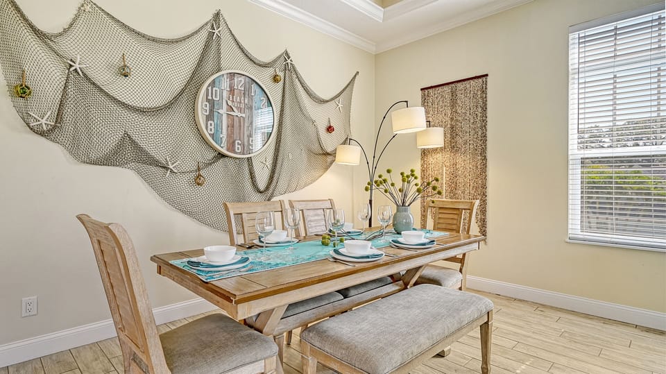 Gather 'round for coastal-inspired meals, lingering conversations, and relaxed island vibes in this inviting dining space.