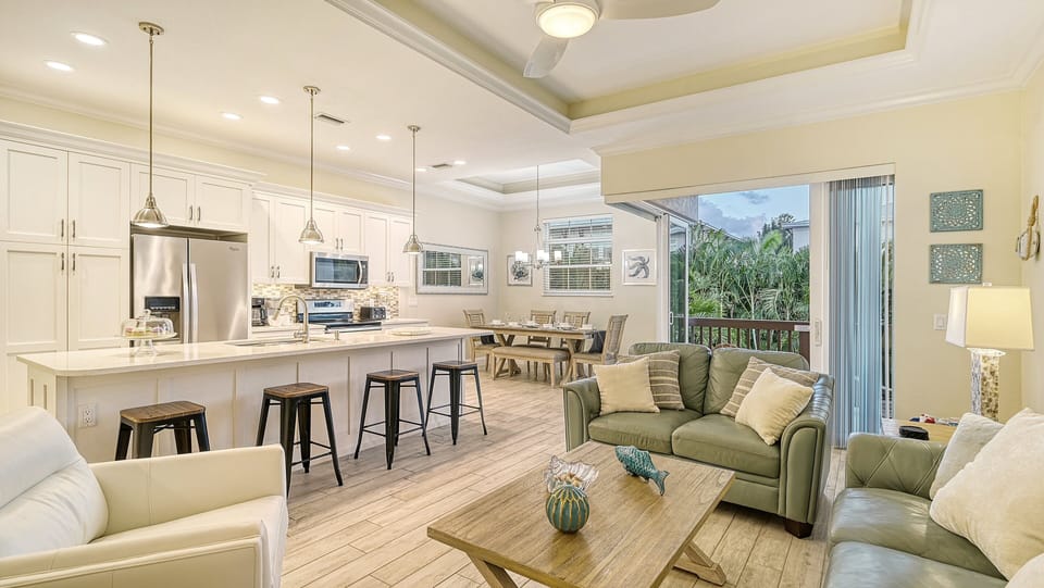 Living Room with kitchen and balcony.