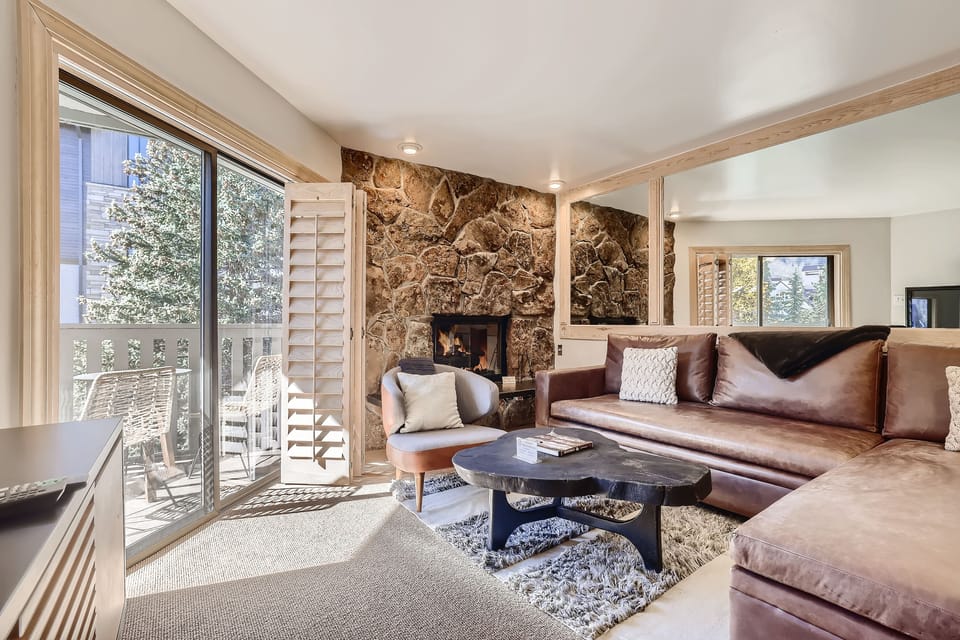 Open living area - Gas fireplace and great deck with views of Vail Mountain