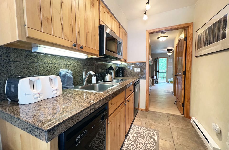 Bright and efficient kitchen area for preparing meals before your adventures.