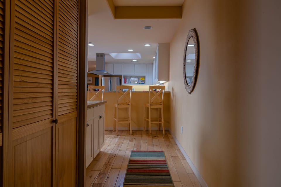 Hallway with Washer/Dryer, and we provide Laundry Pods for your