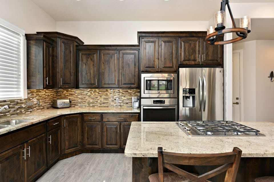 Kitchen - The Kitchen is complete with everything you will need for meal preparations including pots, pans, baking dishes, plates, cups, silverware, cutlery, and an assortment of cooking utensils.