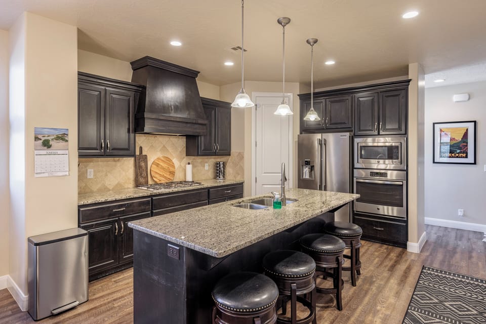 Kitchen - The Kitchen is complete with everything you will need for meal preparations including pots, pans, baking dishes, plates, cups, silverware, cutlery, and an assortment of cooking utensils.