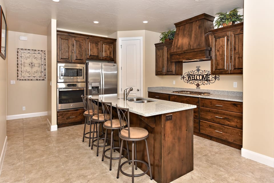 Kitchen - The kitchen is fully stocked with all the dishes, cookware, baking pans, and cutlery you will need for meal preparations and includes stainless steel appliances and granite counter tops.