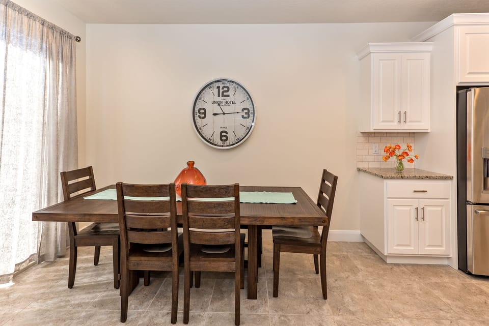Dining Table - The Dining Room comfortably accommodates 6 adults at the dining table.  4 bar stools are also located at the kitchen island.