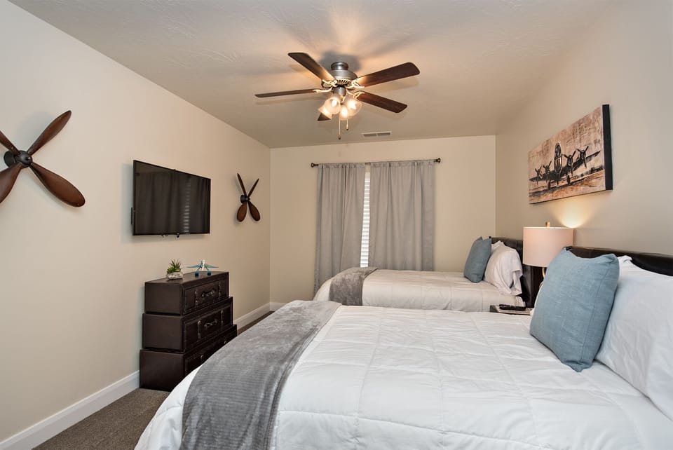 Bedroom 3 - Bedroom 3 is furnished with 2 Full size beds and inculdes a private TV, night stand, lamp, and ceiling fan.