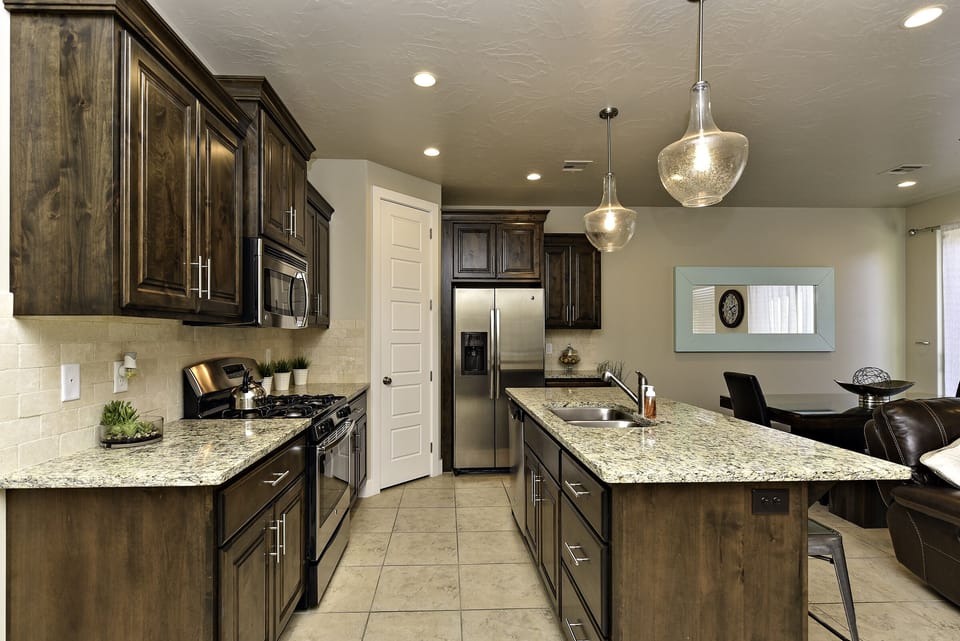 Side View of Kitchen - Side view of kitchen showing off the beautiful counter tops and stainless-steel appliances.