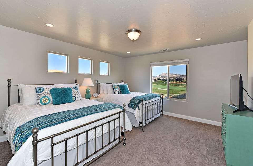 Bedroom 4 - Bedroom 4 is a large bedroom which includes two queen beds, walk-in closet and private satellite TV.