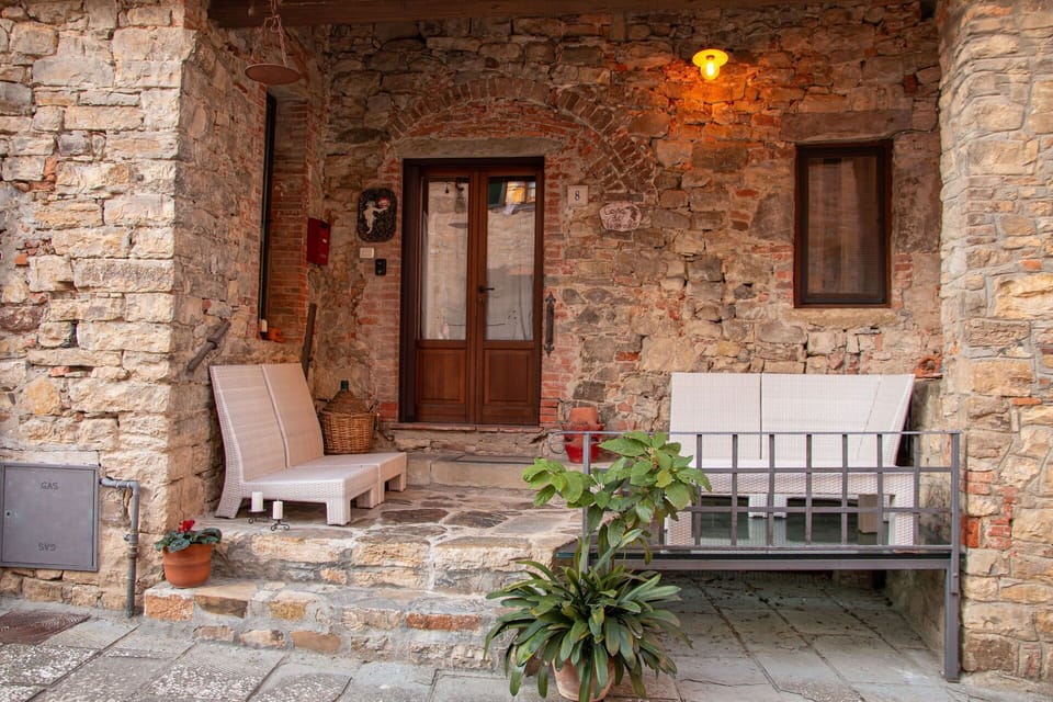 Wall, Furniture, Flowerpot, Flooring, Door, Brick, Stone Wall, Houseplant, Chair, Flagstone
