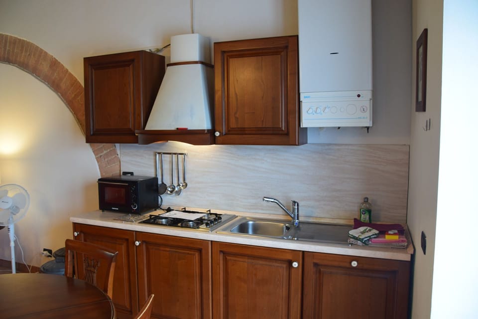 rocche-di-valiano-chianti-castelnuovo-berardenga-multiproprietà-ginestra-kitchen