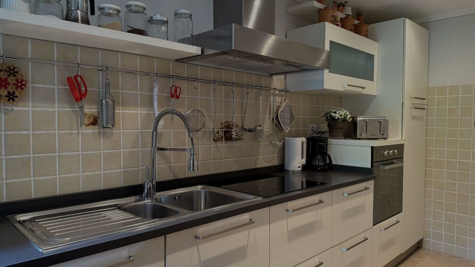 Kitchen, Countertop, Kitchen Sink, Sink, Cabinetry, Kitchen Appliance, Interior Design, Flooring, Plumbing Fixture, Tap