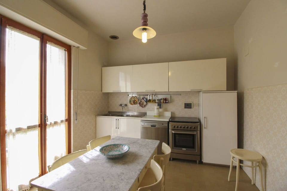 Flooring, Interior Design, Furniture, Kitchen, Floor, Wood, Countertop, Ceiling, Kitchen Appliance, Light Fixture