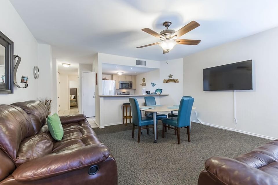 Our compact condo packs a BIG punch with ultra-comfy couches, petite dining space, and fully-equipped kitchen!