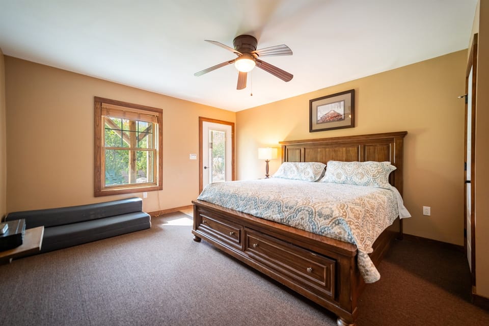The lower level bedroom 3 is spacious and has a king bed and private door to the outside. A queen-size foam mattress is available.