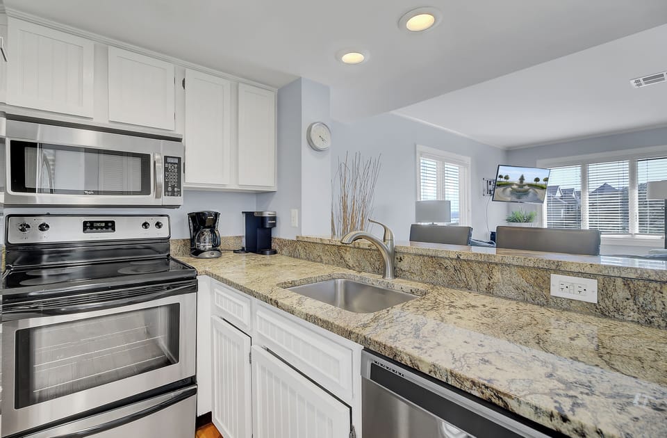 Granite countertops to compliment the fully equipped kitchen.