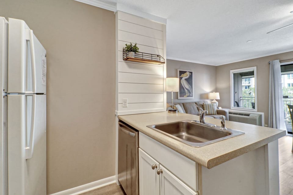 Kitchen - Kitchen overlooks main living area so you can always be part of the action!  And a dishwasher to make cleaning up easy.