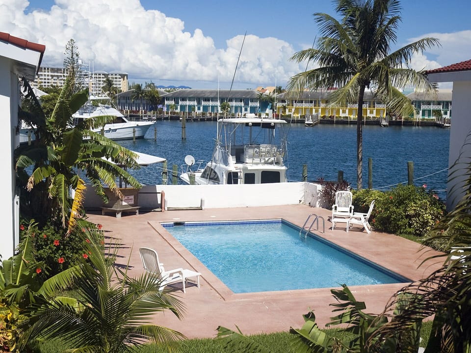 A view of the pool area as seen from the apartment balcony
