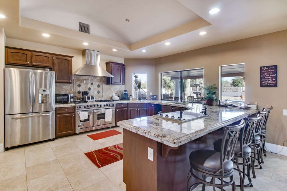 Fabulous Chef's kitchen featuring large fridge, dishwasher both gas and flat top stove