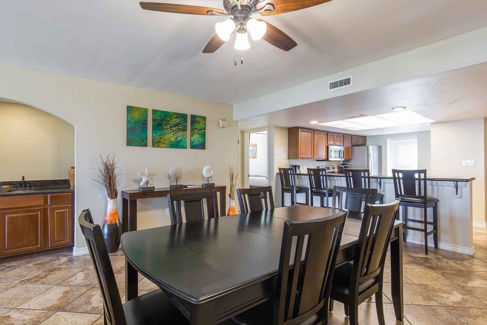 Room for six at the dining table with seating for more at the kitchen bar
