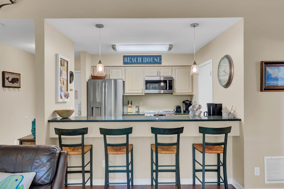 Granite countertops and bar seating – perfect for family meals.