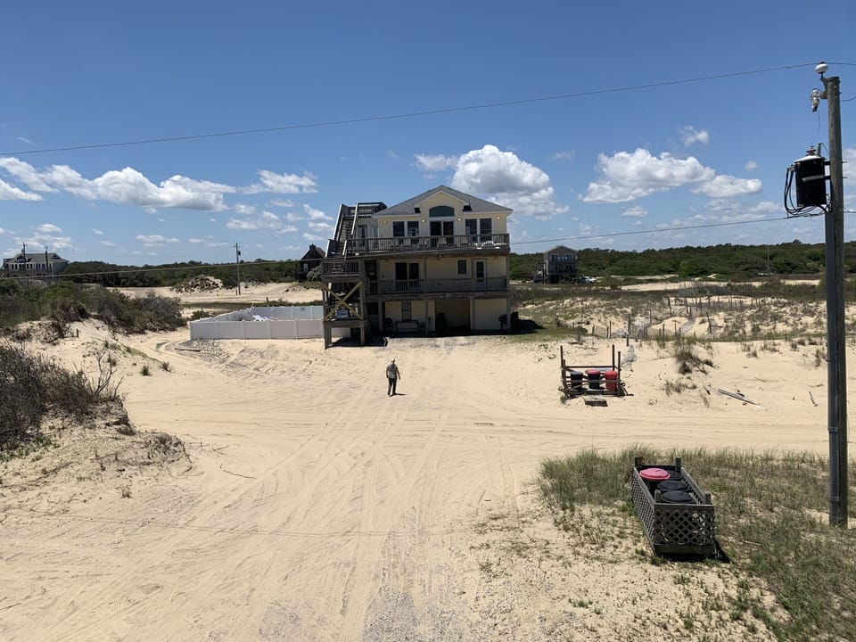 Front view of Playing Hooky- so secluded. - Front view of Playing Hooky vacation rental on elevated lot, Carova Beach 4x4 Northern Outer Banks NC