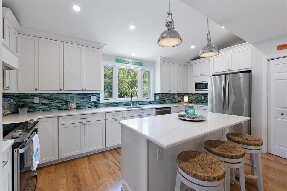 Updated kitchen and barstool seating.