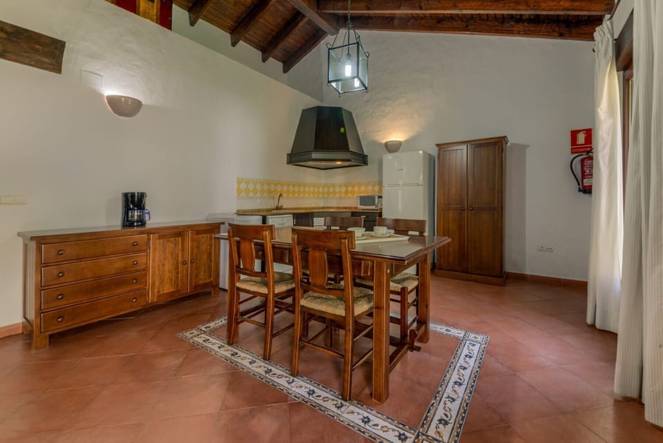 Table and chairs of El Palmeral and Los Naranjos country houses kitchen  in Hacienda Roche Viejo in Conil