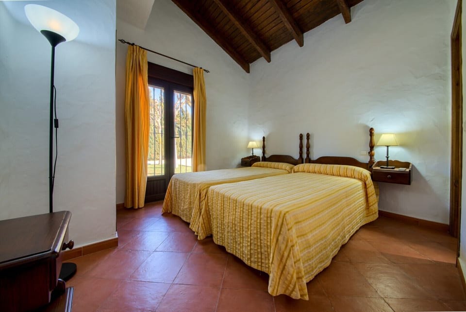 The beds of the bedroom of El Palmeral and Los Naranjos country houses in Hacienda Roche Viejo in Conil