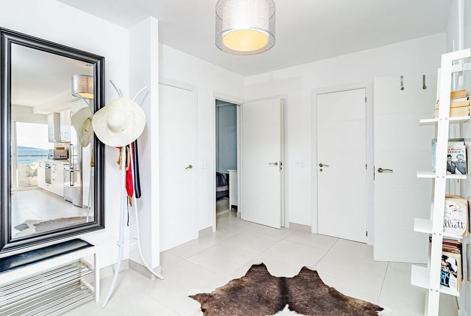 The apartment in Estepona has 3 bedrooms and has capacity for 6 people. 
The apartment is tastefully-furnished, is ample, and is 80 m². The property is located right next to the beach. It has views of waterfront and the mountain. 