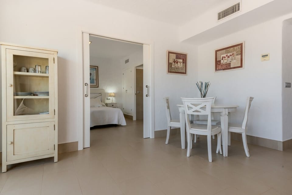 Dining table and entrance to the bedroom from the Villa Poniente Dining room in Villas Flamenco Beach in Conil